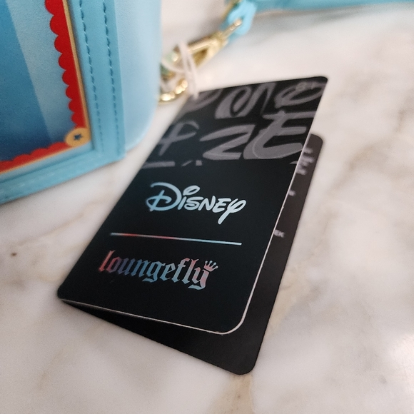 Loungefly Dumbo Storybook Convertible Backpack and Crossbody Bag - Picture 13 of 15